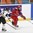 Russia's Anna Shibanova #70 pulls the puck away from Germany's Manuela Anwander #5during preliminary round action at the 2013 IIHF Ice Hockey Women's World Championship. (Photo by Jana Chytilova/HHOF-IIHF Images)
